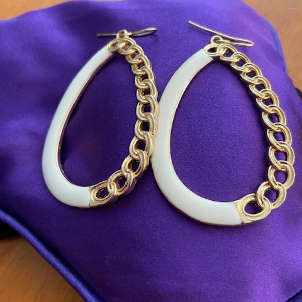 White lacquer and gold colored earrings